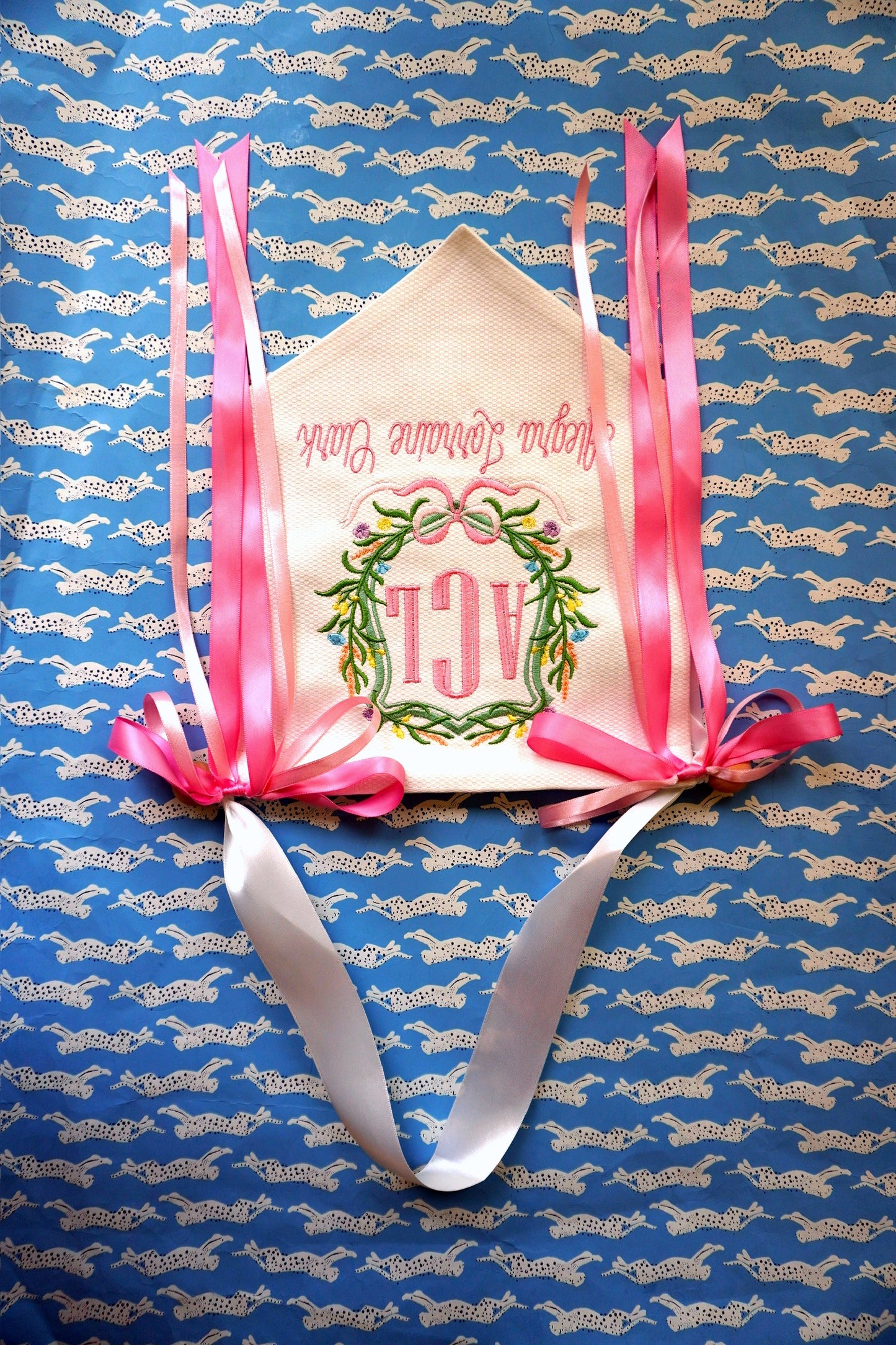 John Oliver Designs - Pique banner, monogram wreath, pink ribbons