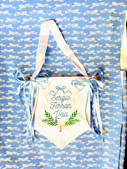 John Oliver Designs - Pique banner, stork + wreath, blue ribbons, on cheetah bg