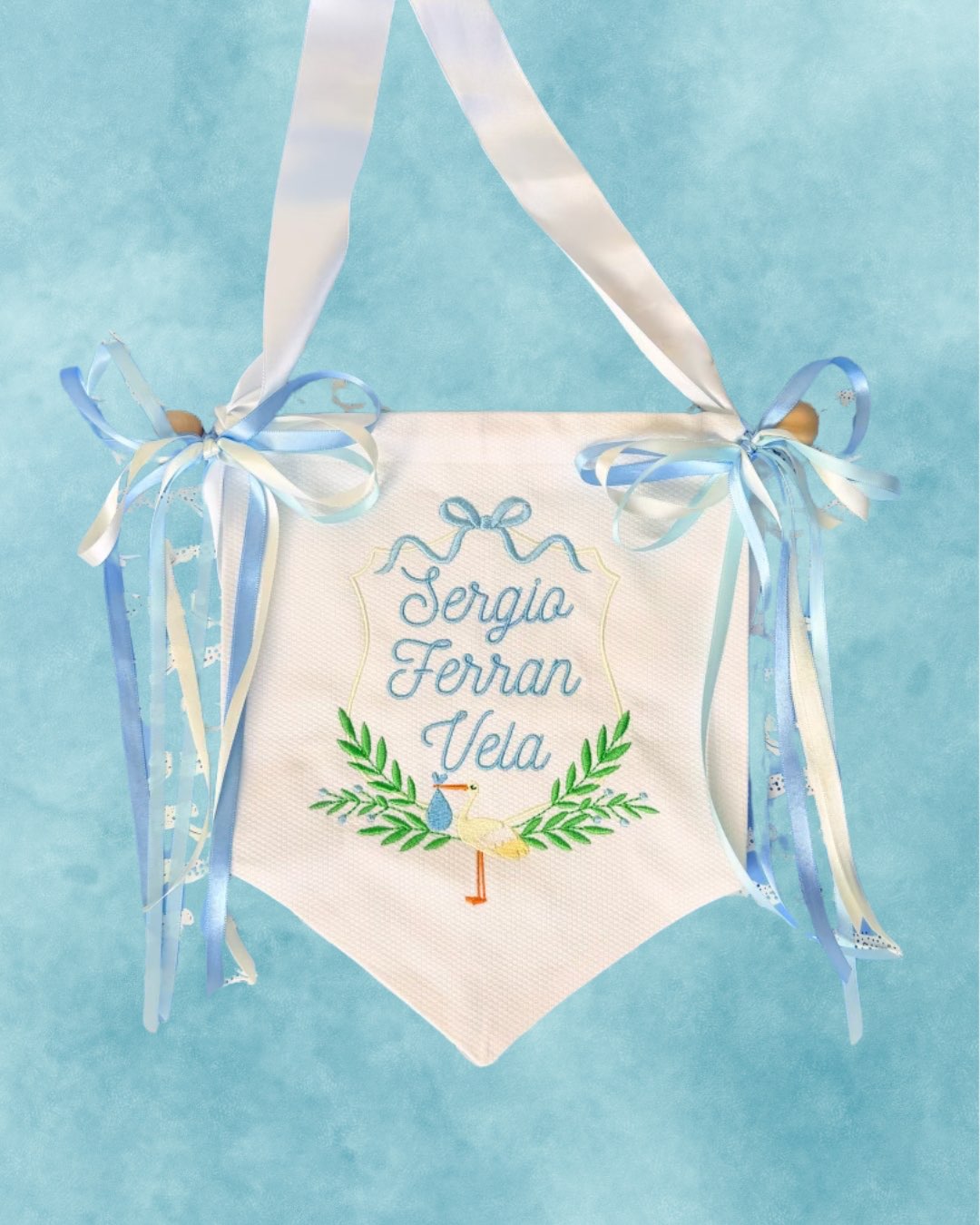 Cotton Pique Banner, hand-embroidered with baby name and stork design, blue ribbon