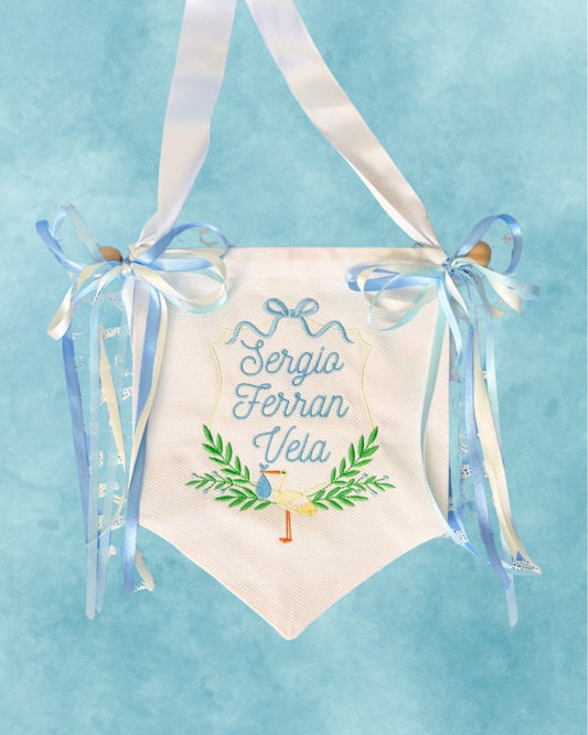 Cotton Pique Banner, hand-embroidered with baby name and stork design, blue ribbon