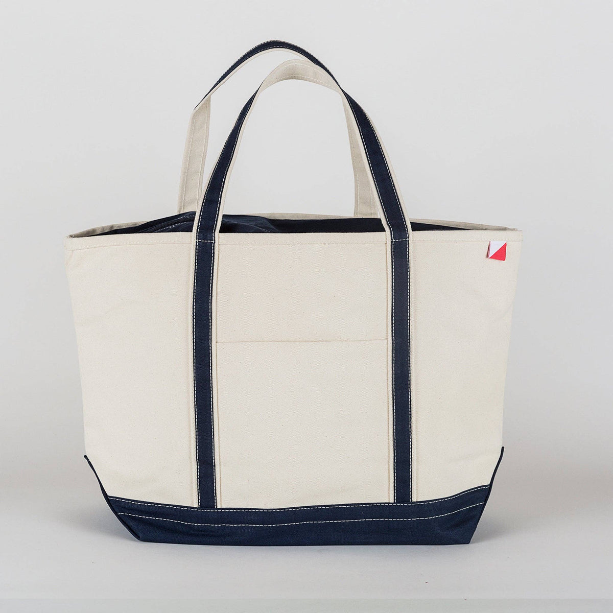 Large canvas tote showing the zippered top closure