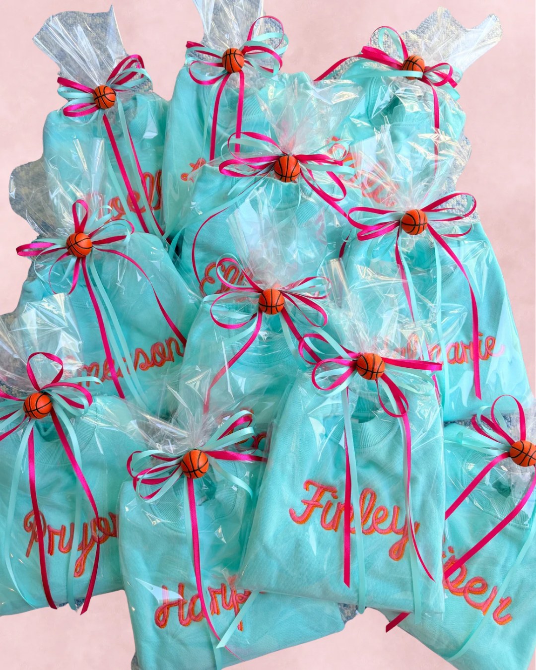 A pile of wrapped personalized team gifts